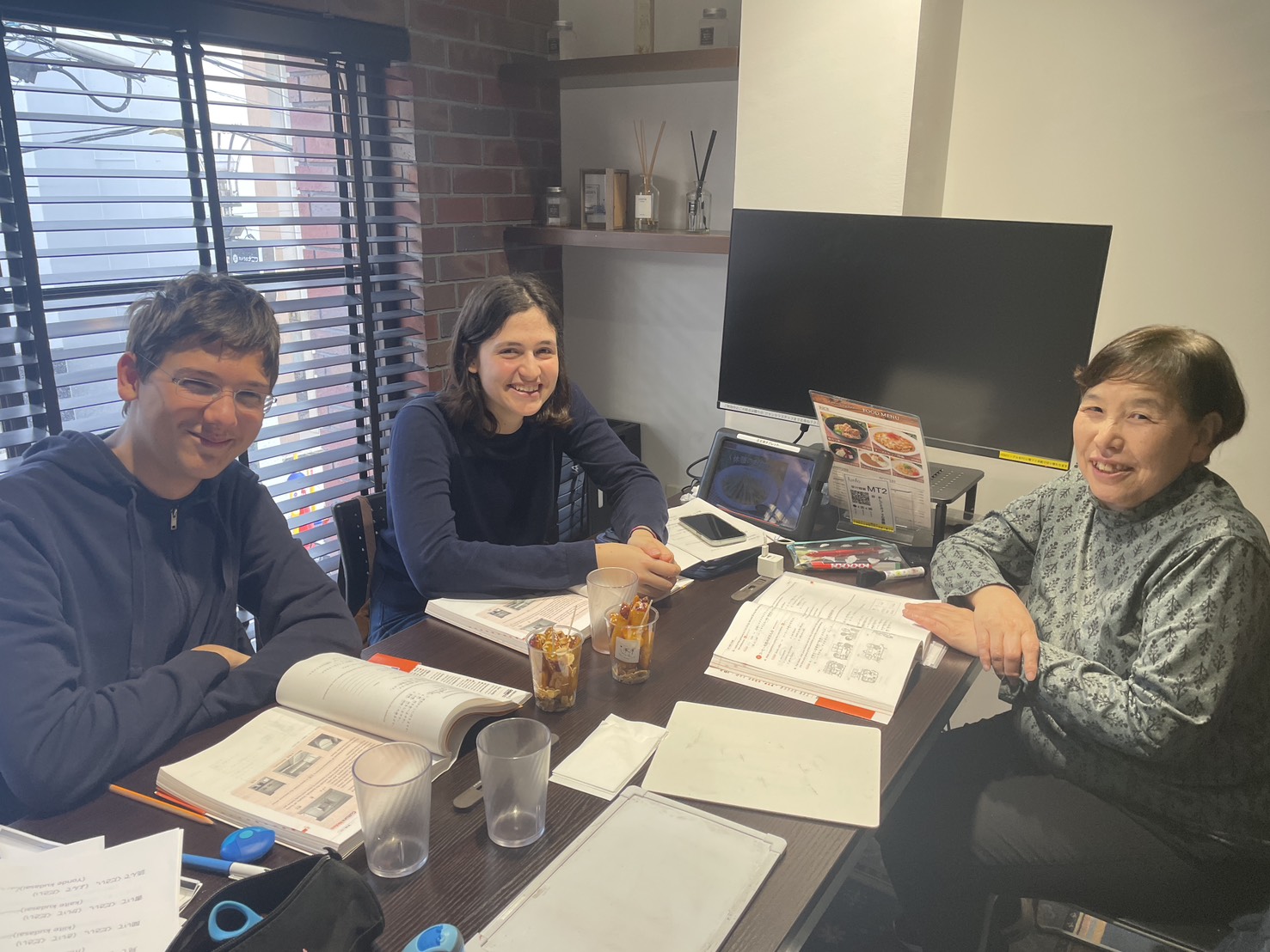 Two students with their teacher at LTL Osaka