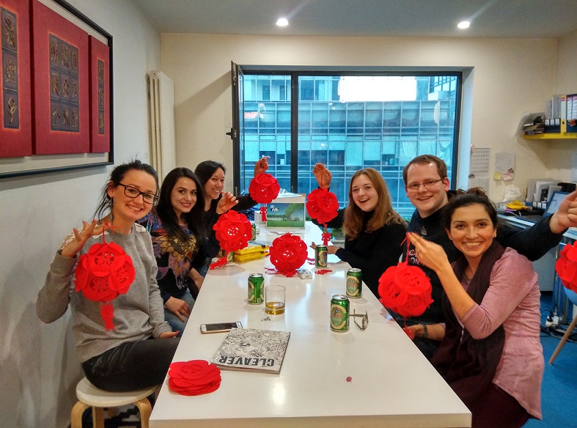 A group of students with Chinese decorations at LTL Beijing