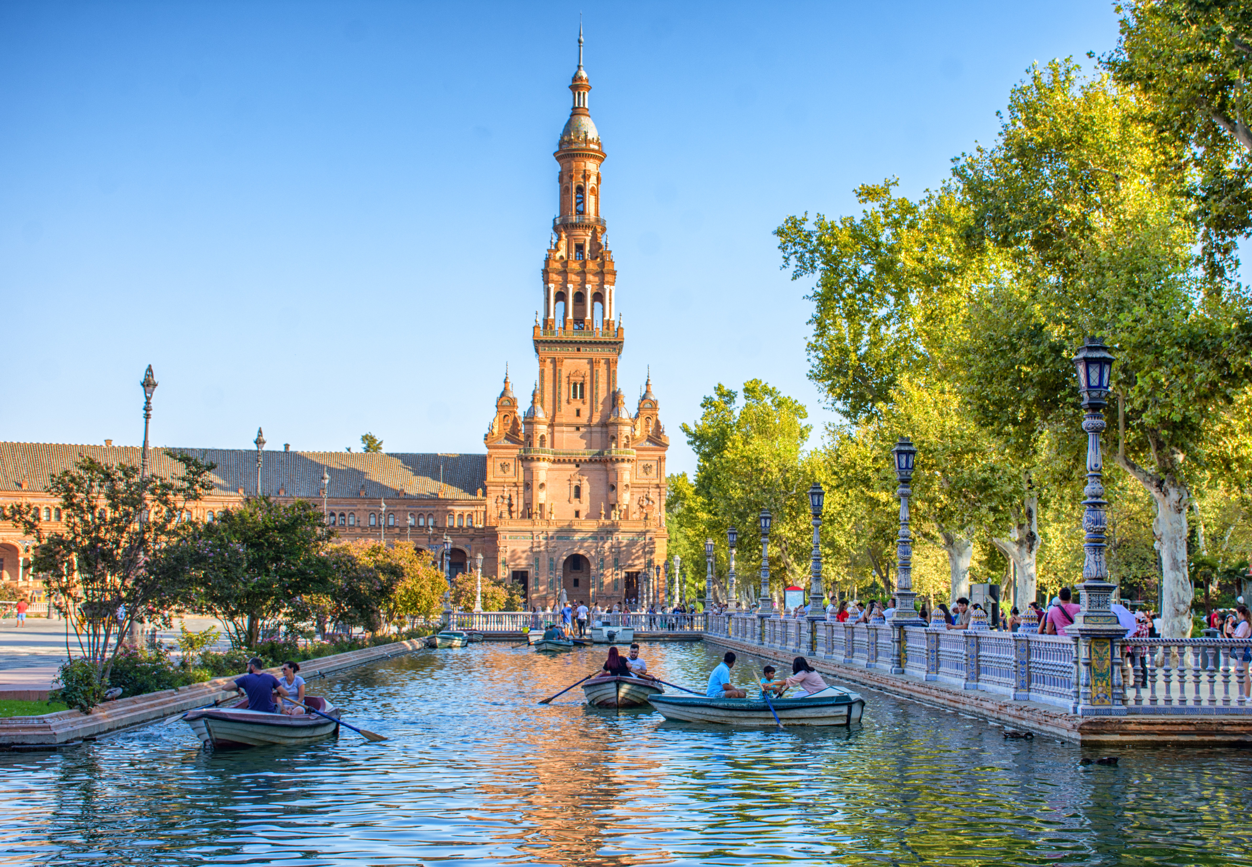Plaza de España in Seville, Spain, with semicircular architecture, colorful tilework, arches, and a central canal with ornate bridges