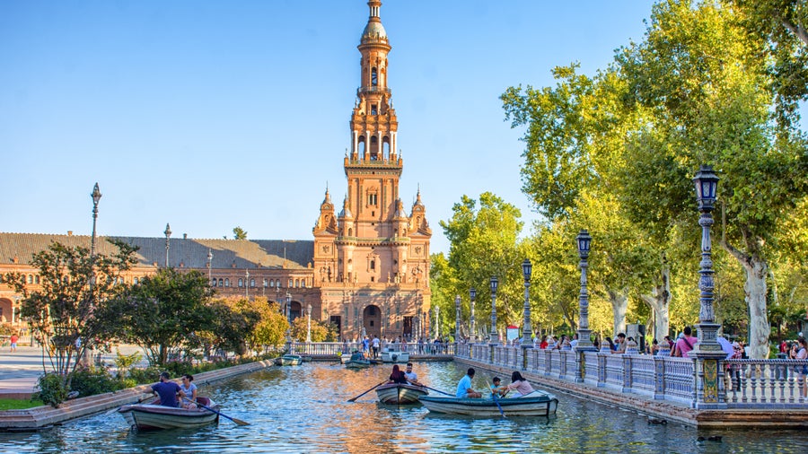 Plaza de España in Seville, Spain, with semicircular architecture, colorful tilework, arches, and a central canal with ornate bridges