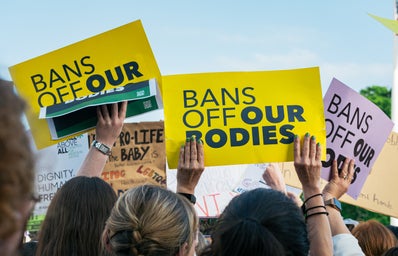 Posters reading \"Bans Off Our Bodies\"