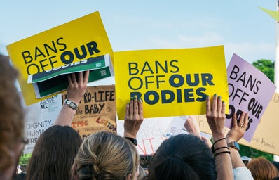 Posters reading \"Bans Off Our Bodies\"