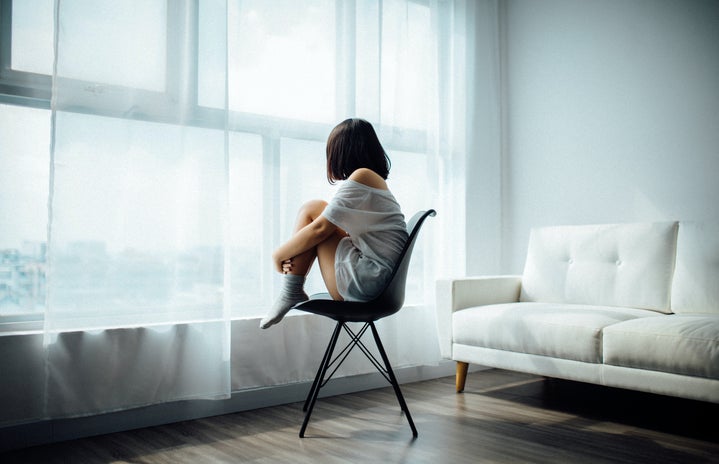 woman sitting alone looking out window by ANTHONY TRAN?width=719&height=464&fit=crop&auto=webp