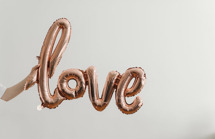 Helium balloons that spell \'love\' in cursive