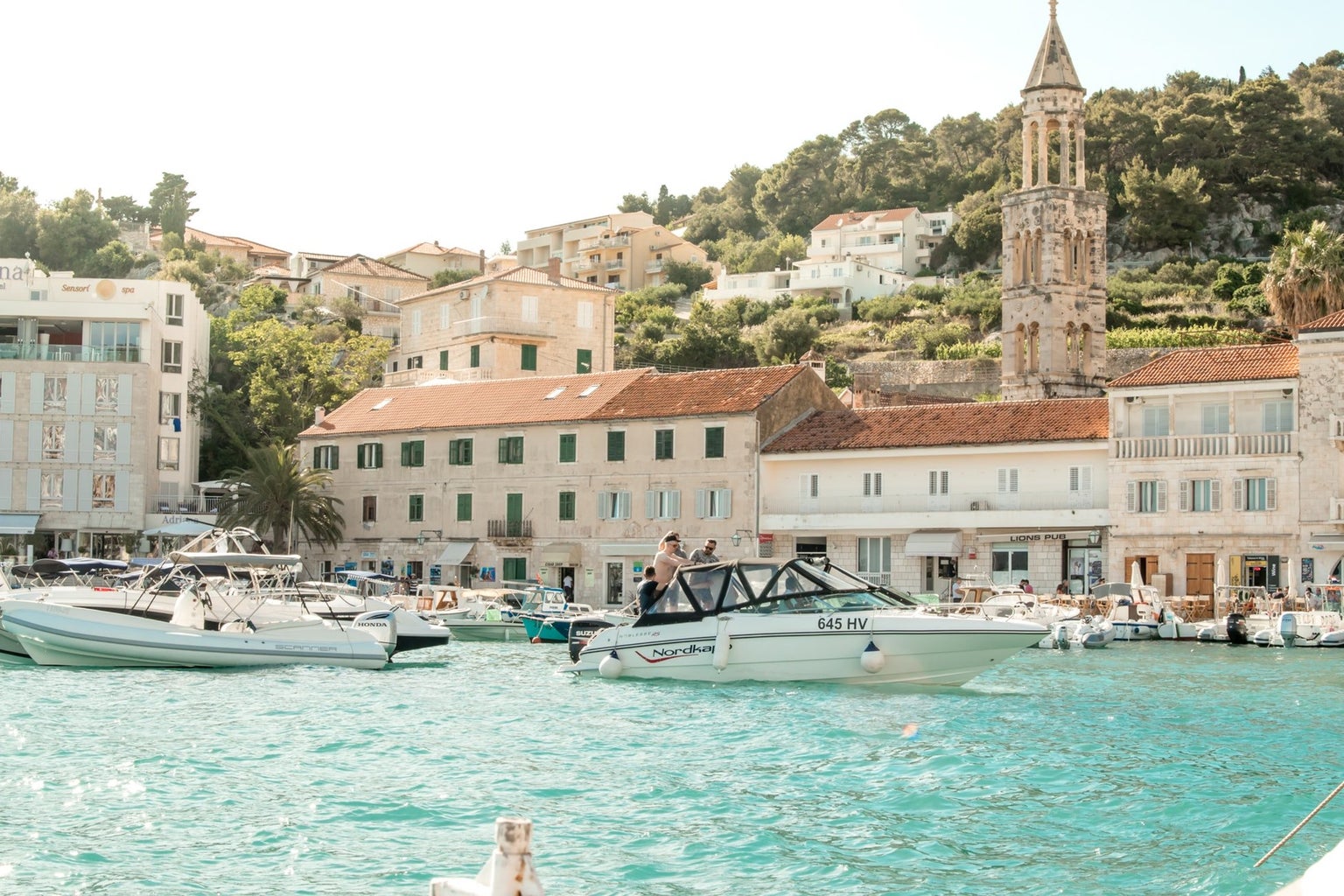 boats with scenic background, crystal blue ocean