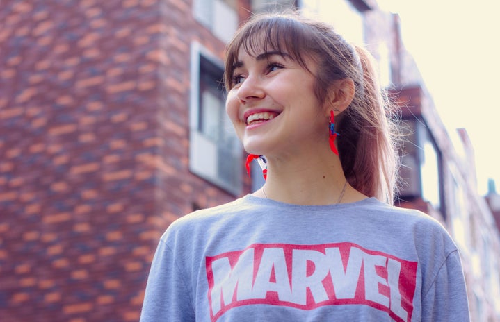 woman wearing Marvel shirt by Timur Romanov?width=719&height=464&fit=crop&auto=webp