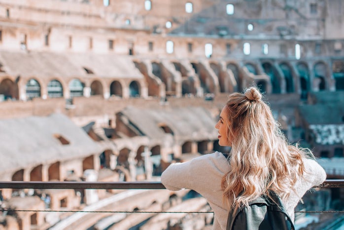 Woman visiting the Colosseum in Rome Italy by Courtney Cook via Unsplash?width=698&height=466&fit=crop&auto=webp