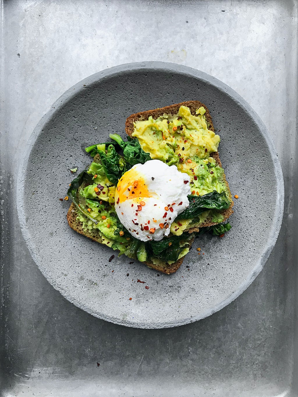 Toast with avocado and egg on top