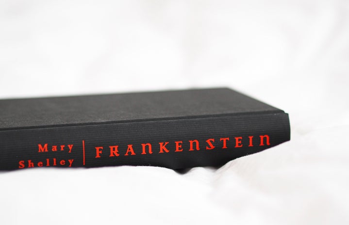 black Frankenstein book in a white sheet