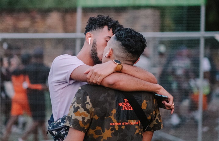 queer couple kissing glodi miessi unsplash?width=719&height=464&fit=crop&auto=webp