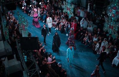 a runway of a fashion show with models