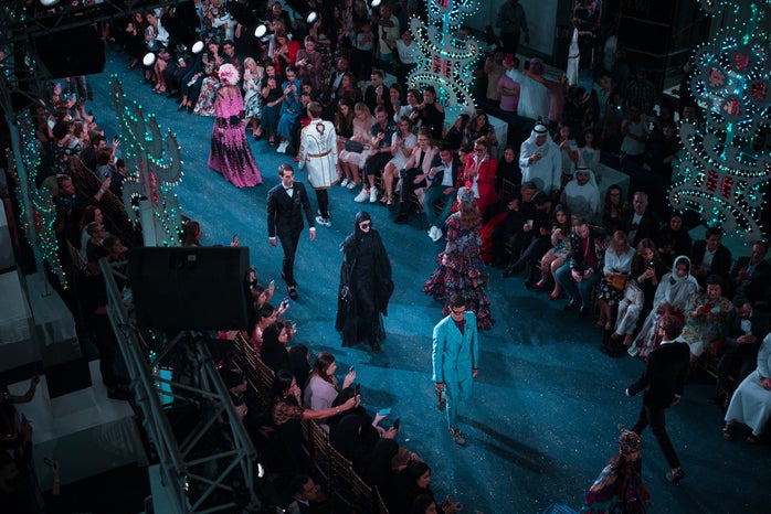 a runway of a fashion show with models