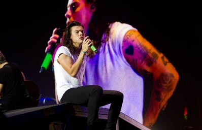 Harry Styles singing on stage