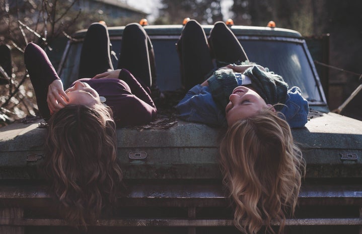 Girls lying on a car by Free Photos?width=719&height=464&fit=crop&auto=webp