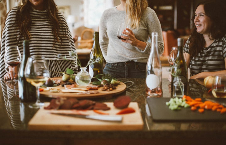 three women hosting a dinner party by Kelsey Chance via Unsplash?width=719&height=464&fit=crop&auto=webp