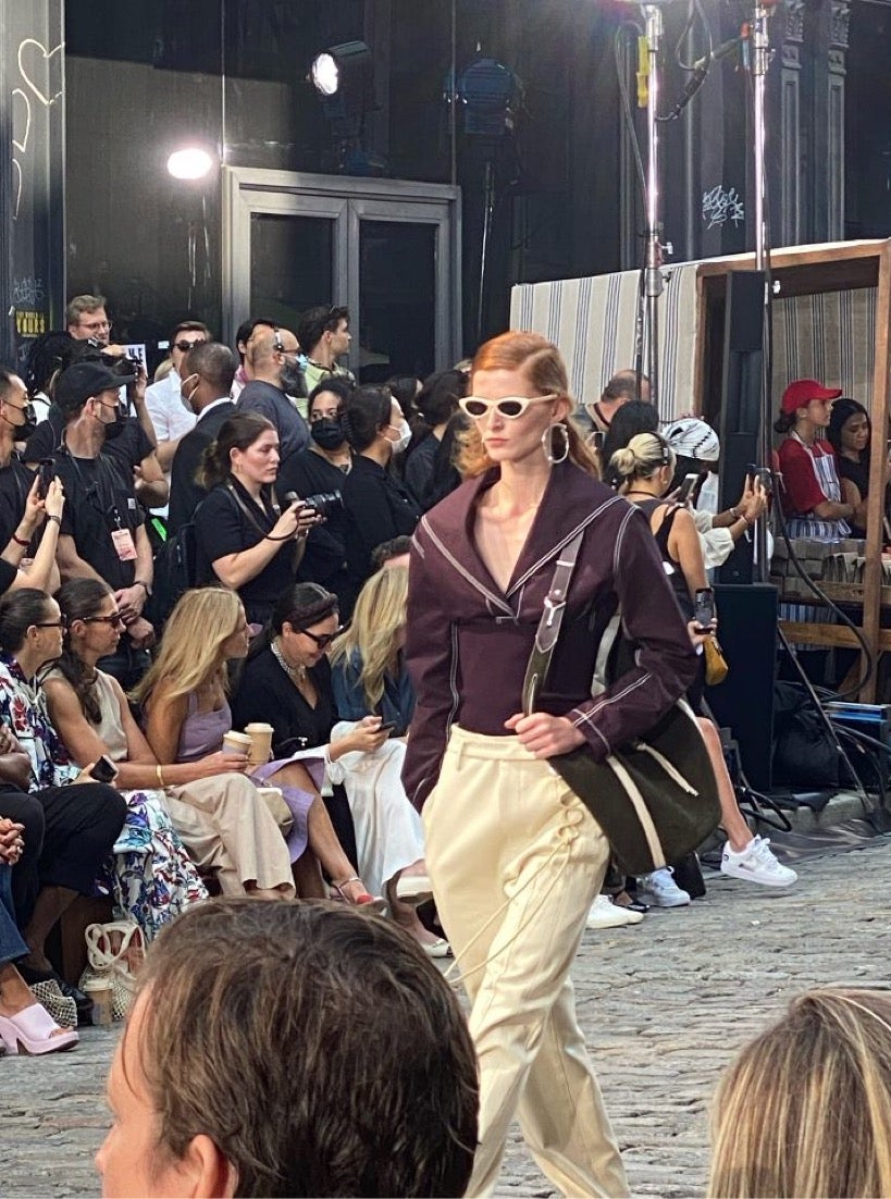 A model at New York Fashion Week 2021 sports Tory Burch