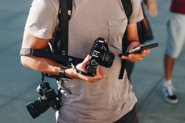 man with cameras