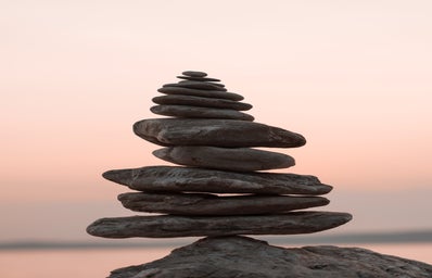 Closeup photography of a pile of rocks against a sunset backdrop