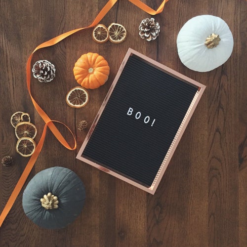 letter box with boo! on it and small pumpkins