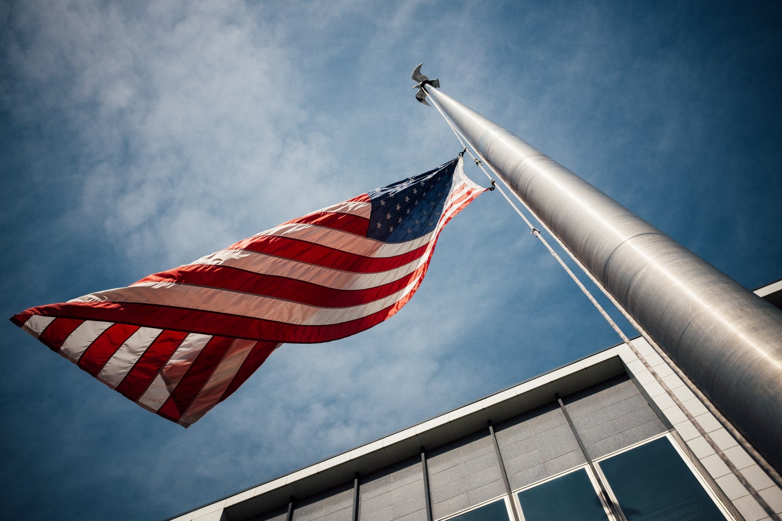 american flag against blue sky