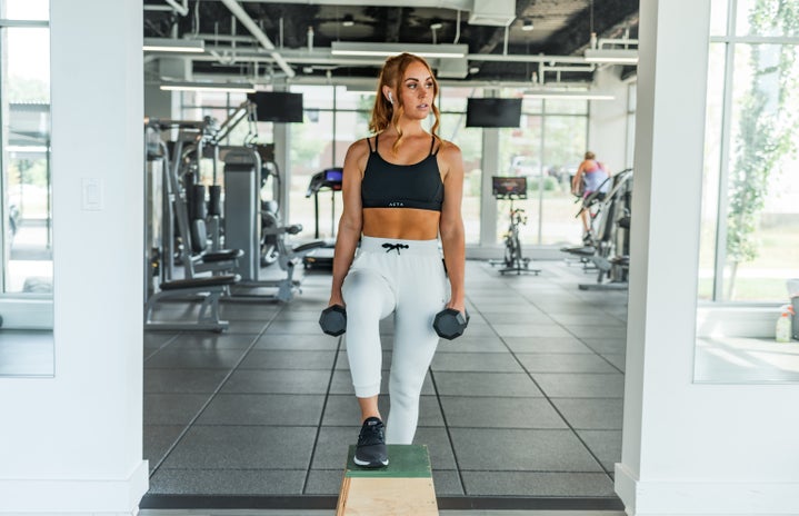 woman exercising at gym