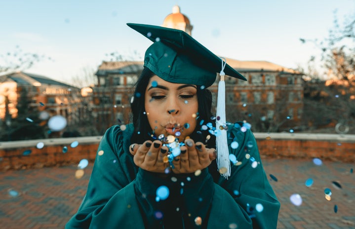 woman in green graduation gown blowing confetti by Clay Banks on Unsplash?width=719&height=464&fit=crop&auto=webp