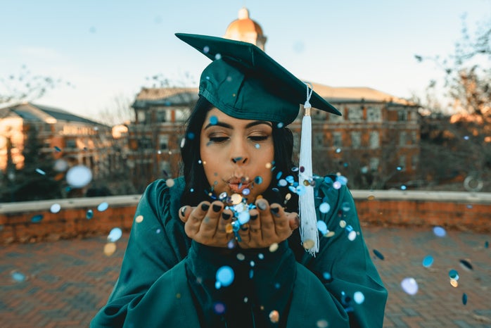 woman in green graduation gown blowing confetti by Clay Banks on Unsplash?width=698&height=466&fit=crop&auto=webp
