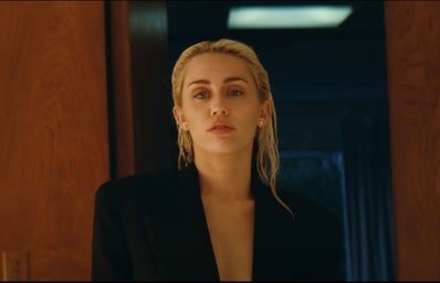 A screenshot from Miley Cyrus \"Flowers\" music video