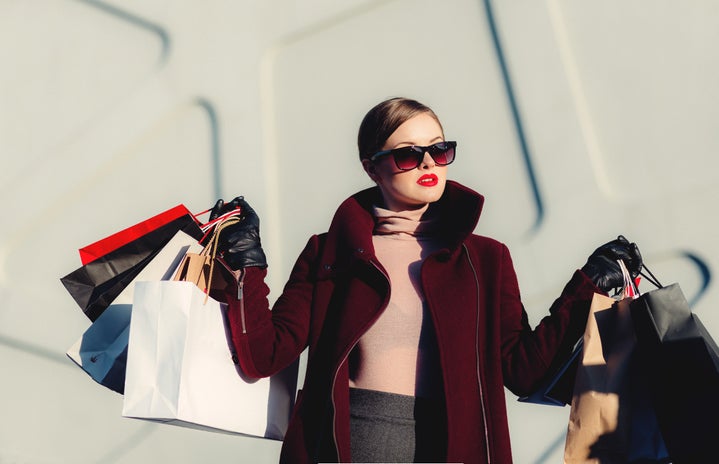 woman shopping holding shopping bags by freestocks on Unsplash?width=719&height=464&fit=crop&auto=webp