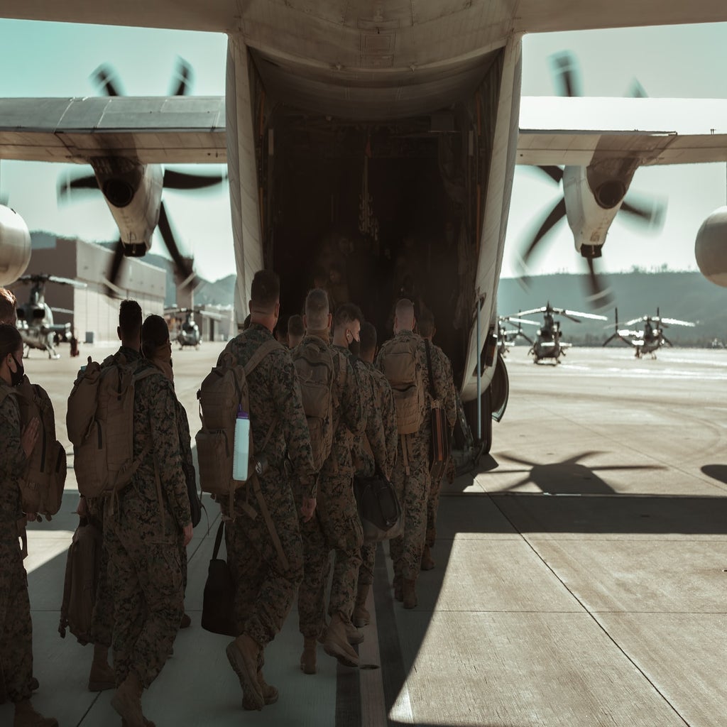 U.S. Marines boarding a plane for deployment.