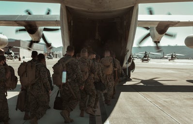 U.S. Marines boarding a plane for deployment.