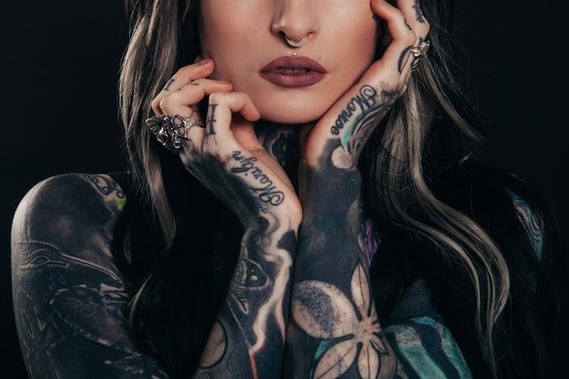 woman covered in tattoos by Unsplash?width=698&height=466&fit=crop&auto=webp