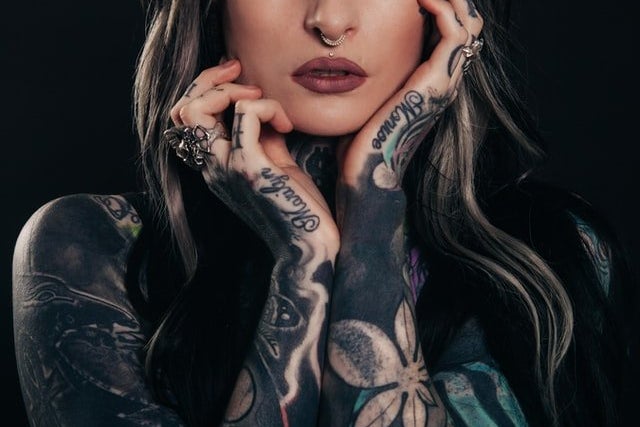 woman covered in tattoos by Unsplash?width=698&height=466&fit=crop&auto=webp