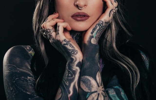 woman covered in tattoos