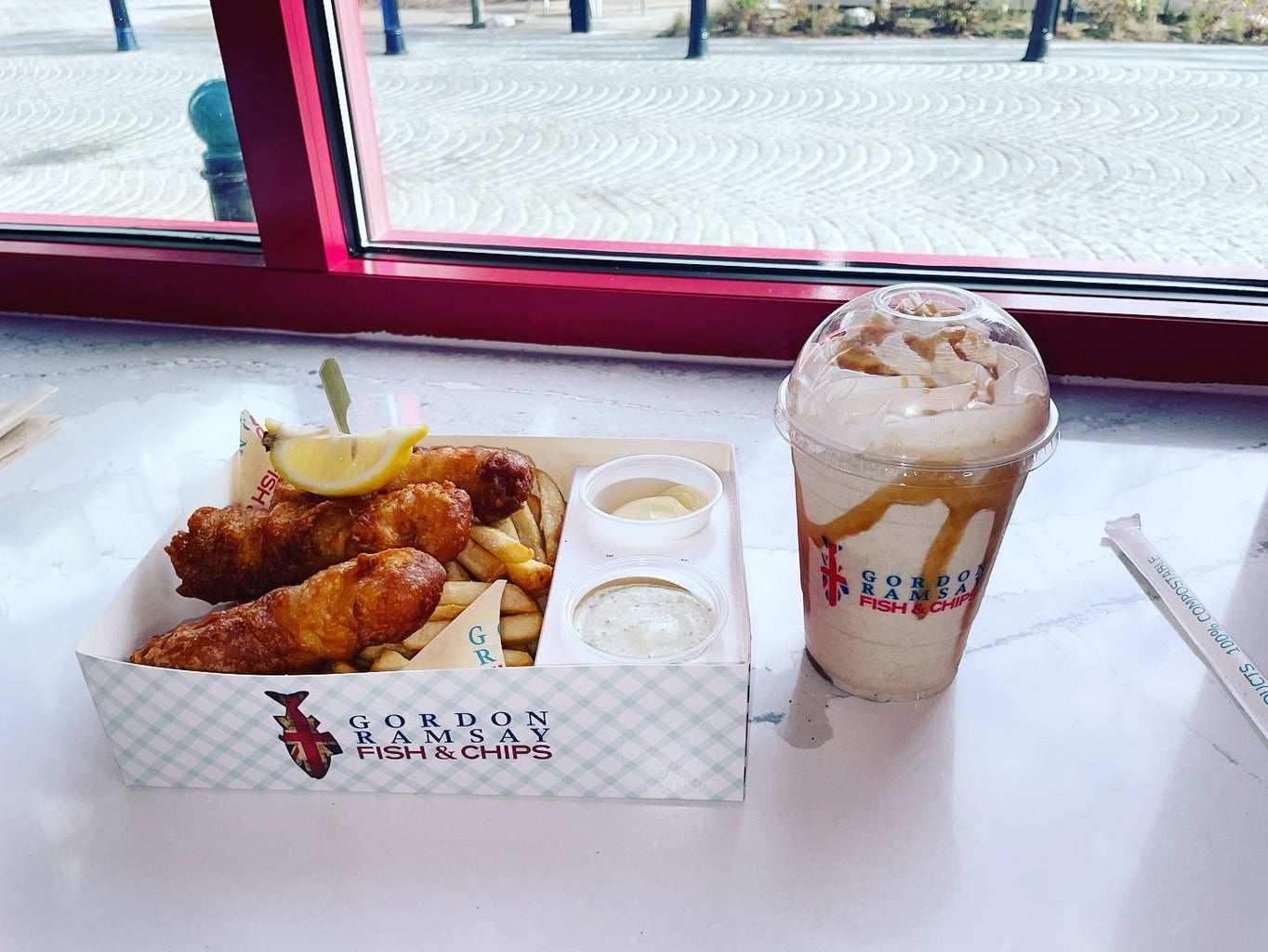 The fish and sea salt fries combo with a toffee drip milkshake served at  Gordan Ramsey\'s new fish and chip shop at the Warf D.C.