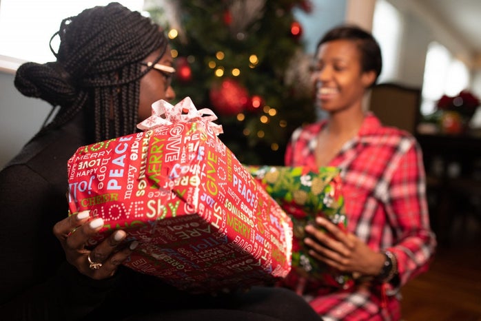 Black family opening presents on Christmas