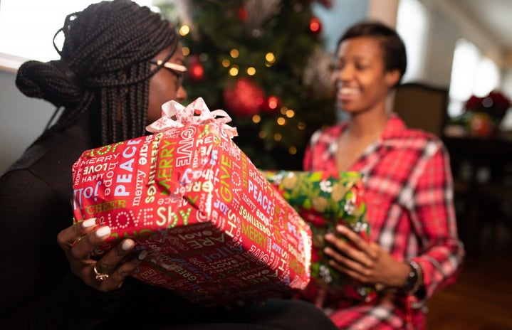 Black family opening Christmas presents by NappyStock?width=719&height=464&fit=crop&auto=webp