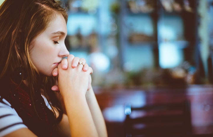 woman praying with eyes closed by Ben White?width=719&height=464&fit=crop&auto=webp