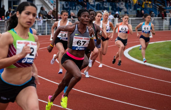 women running a track race