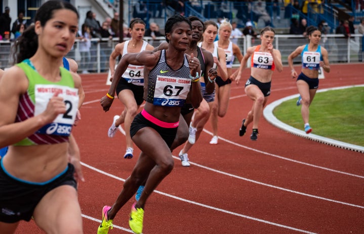 women running a track race