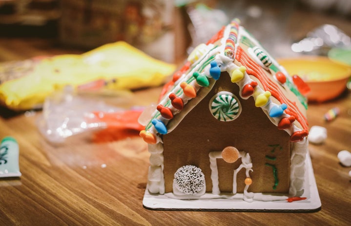 gingerbread house on a table by Randalyn Hill?width=719&height=464&fit=crop&auto=webp