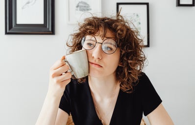 woman with coffee mug thinking