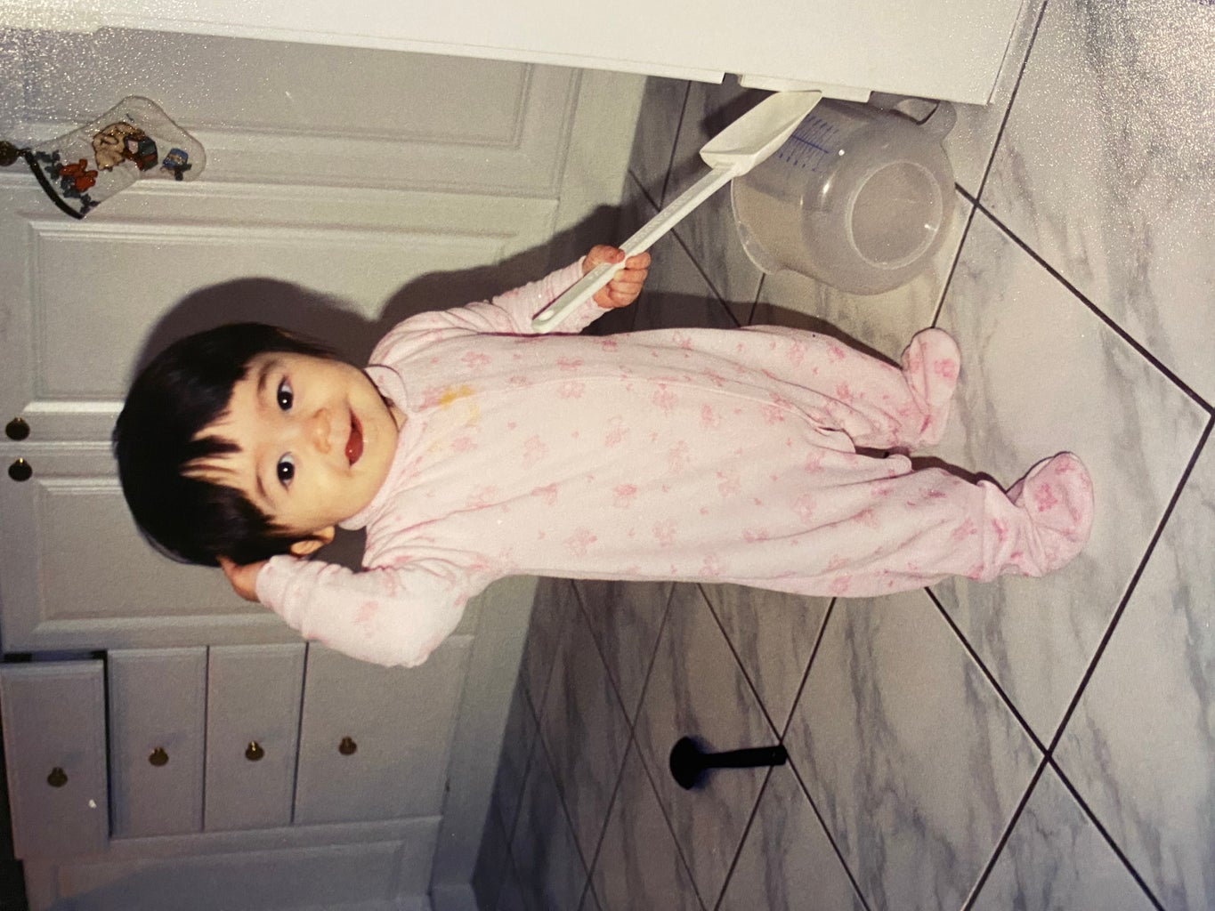 my sister cooking as a baby