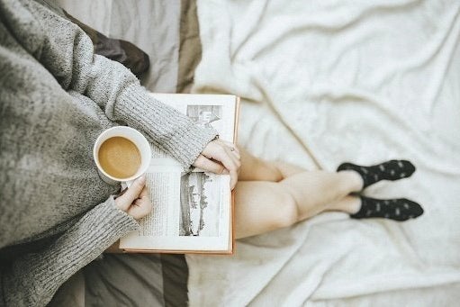 girl with coffee and book