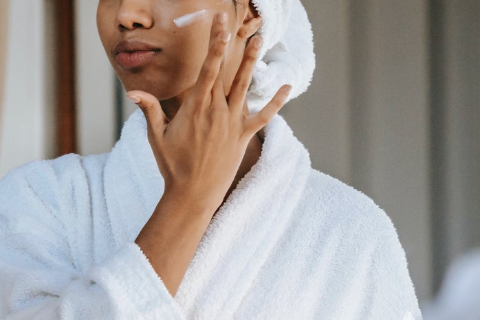 woman applying lotion
