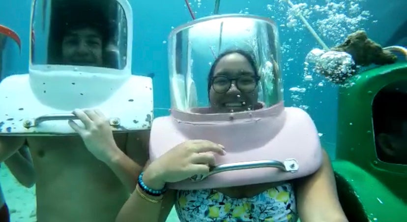 Photo of couple helmet diving.