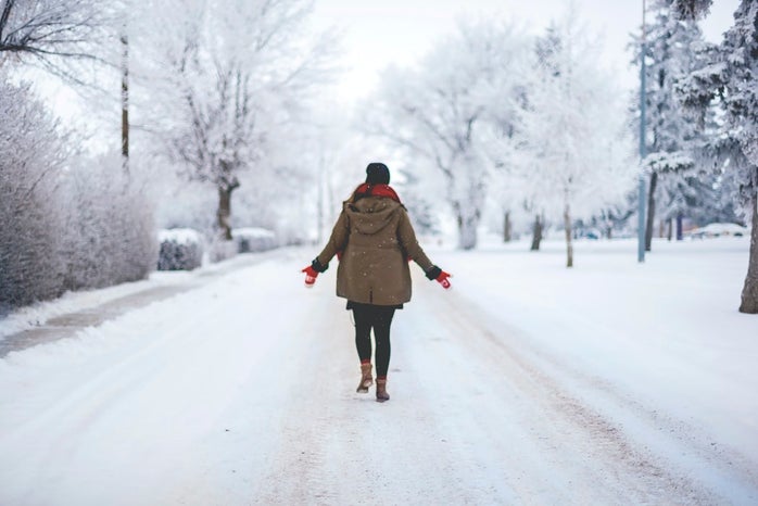 person walking in snow by Genessa Panainte?width=698&height=466&fit=crop&auto=webp