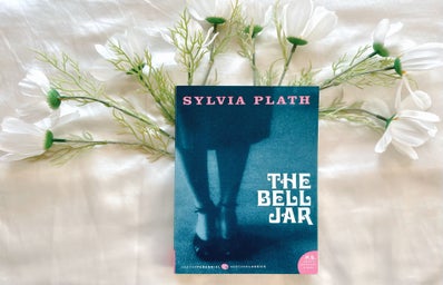 A picture of a book \'The Bell Jar\' with flowers