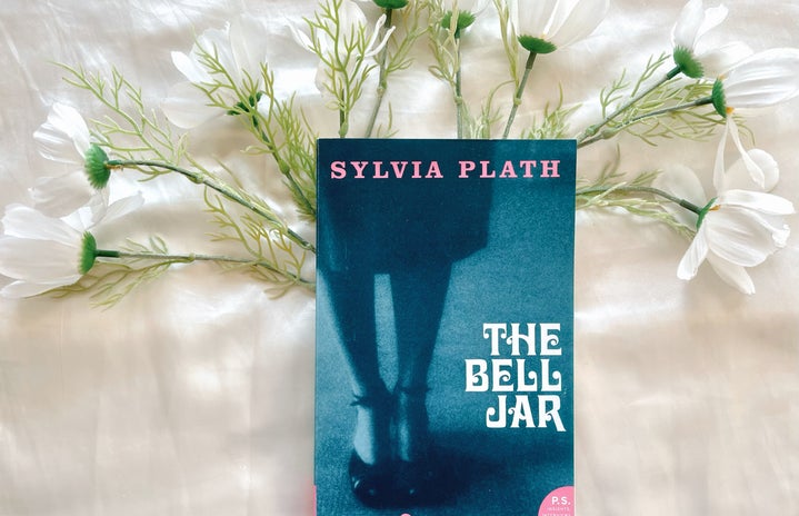 A picture of a book \'The Bell Jar\' with flowers