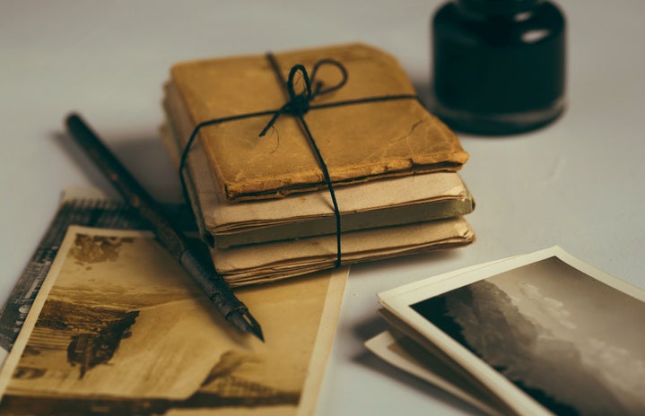 Photographs and letters wrapped together with an ink pen.